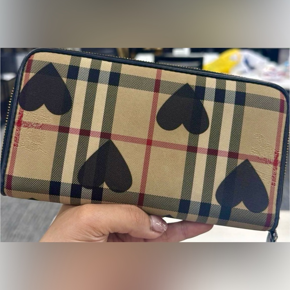 Authentic Pre-loved Burberry with black hearts zipper wallet